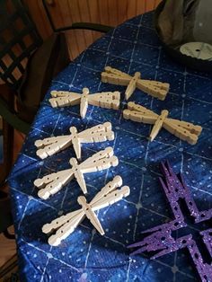 several wooden crosses sitting on top of a table