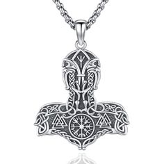 an intricate celtic cross pendant on a chain