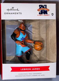 an action figure in a box with the name leron james on it's chest