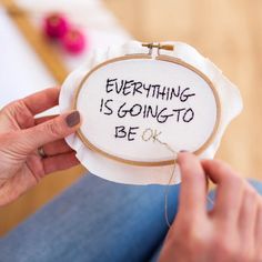 someone is stitching something with the words everything is going to be ok