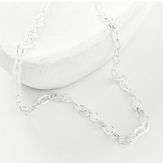 this silver chain can be worn alone as a simple, subtle statement or as a layering piece. Classic Silver Charm Necklace, Silver Charm Necklaces With Adjustable Oval Link Chain, Classic Silver Chain Charm Necklace, White Link Necklace With Silver Chain, Everyday Silver Link Chain Necklace, Silver Oval Link Chain Necklace As Gift, Silver Oval Link Charm Necklace For Everyday, Sterling Silver Link Chain Charm Necklaces, Classic Sterling Silver Charm Necklace With Cable Chain