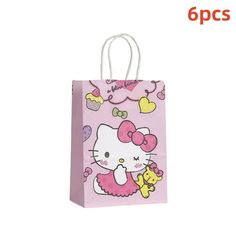 a pink hello kitty bag with hearts on it