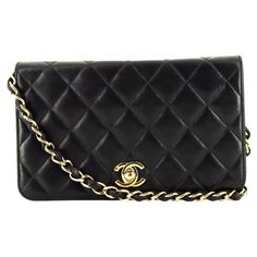 Chanel black lamb leather "Mademoiselle" crossbody bag featuring iconic quilted leather, gold tone hardware with front closure, the iconic signature gold-tone metal and leather interwoven shoulder strap (Length:37.7 in. (96cm)), inside burgundy leather with a flat pocket and inside serial number. - Length: 7.4in. (19cm) - Height: 4.3in. (11cm) - Width: 1.18in. (3cm) Made in France Circa: 2008 In good vintage condition. We guarantee you will receive this gorgeous item as described and showed on p Slim Aarons, Chanel Black, Quilted Leather, Gold Tone Metal, Fashion Handbags, Evening Bags, Metallica, Leather Bag, Crossbody Bag