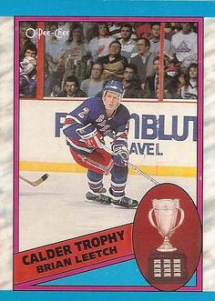 a hockey card with an image of a man on the ice holding a trophy in his hand