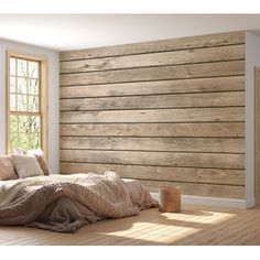 a bedroom with wood paneling on the wall