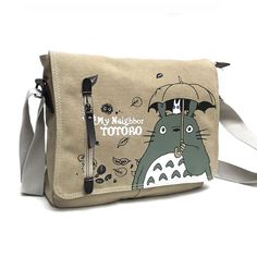 Go on an adventure with Mei, Satsuki and Totoro by using the Totoro messenger bag for all your travels. An elegant, practical and resistant bag that will become your best companion on the road. A small shoulder bag designed for men and women who are regularly on the go and need to carry their personal belongings with them. A small elegant messenger bag with the effigy of your favorite character : Totoro Meet the adorable Totoro character in an original messenger bag featuring the Japanese animat Casual Satchel Bag For Adventure, Adventure Shoulder Bag With Adjustable Strap, Large Capacity Satchel For Adventure, Totoro Messenger Bag, Totoro Bag, Totoro Characters, Practical Bag, Canvas Messenger Bag, Bags Aesthetic