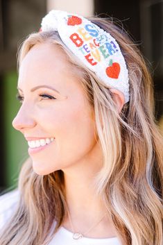 This headband in white is the cutest and trendiest way to show your appreciation to your child's favorite educator! With its beaded design, it's not only a great gift idea but also a fashionable accessory! Treat yourself or that special teacher in your life! Trendy Adjustable Hair Accessories For Gifts, Casual White Headband For Gift, Trendy Adjustable Headband For Gift, Adjustable Fun Multicolor Hair Accessories, Adjustable Novelty White Headband, Cute Adjustable White Headband, Playful Adjustable White Headband, Cute White Headband For Birthday, Trendy Hair Accessories With Matching Headband As Gift