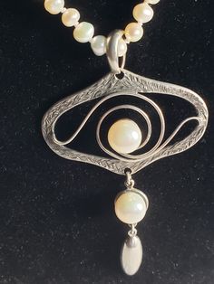 "This designer necklace is so pretty! That Art Nouveau style with lots of swirling sterling  silver. It is large at 3.25\" long with a large bale. The designer name is Kant. Very different and unusual. In perfect, vintage condition on a 22\" curtesy glitter chain or an adjustable mini pearl chain with 3mm pearls from 22\"-24\", your choice! I can send you this beautiful necklace in a gift box tomorrow!" Unique Spiral Sterling Silver Necklace, Artistic Hand Forged Sterling Silver Necklace, Elegant Necklace With Artistic Round Pendant, Elegant Sterling Silver Swirl Necklace, Sterling Silver Necklace With Artistic Design, Hand Forged Silver Spiral Necklace, Artistic Silver Necklaces, Silver Pendant Necklace With Artistic Design, Silver Spiral Necklace For Anniversary