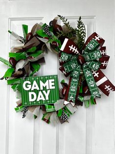 a football wreath with the words game day on it