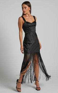 'Step into the spotlight in our Eiren Corset Bodice Tiered Fringe Detail Maxi Dress In Black. This show-stopping piece is perfect for any occasion, from a fancy cocktail party to a formal wedding. The sweetheart neckline and sleeveless design accentuate your curves while the tiered fringe detailing adds playful movement with every step you take. Made of high-quality materials, this dress will have you feeling confident and stylish all night long. Whether you're hitting the town or attending an e Sleeveless Evening Midi Dress With Corset Back, Elegant Black Corset Dress For Party, Cocktail Evening Dress With Sleeveless Corset Back, Prom Season Midi Dress With Corset Back, Fitted Evening Dress With Corset Back For Gala, Sleeveless Evening Dress With Corset Back For Cocktail, Sleeveless Cocktail Dress With Corset Back, Sleeveless Cocktail Evening Dress With Corset Back, Satin Dress For Gala Evening