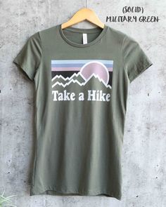 "RUNS TIGHT, size up. I'm 105 lbs/ 5'4\" and I wear a medium comfortably. Can fit in a small as well (fits like a unisex XS) but medium was more comfortable (does fit loosely in a medium, like a unisex S). MAUVE , HEATHER SLATE , MAROON, MILITARY GREEN, and HEATHER MILITARY GREEN NOW COMES IN UNISEX SIZING! made with bella canvas women's favorite cotton tee 100% cotton for solid colors Heather color is 52% cotton, 48% polyester Triblend for the triblend colors (clay, purple triblend, maroon trib Hiking Summer, Woman Hiking, Purple Heather, Hiking Tshirt, Heather Purple, Hiking Shirt, Women Camping, Take A Hike, Hiking Shirts