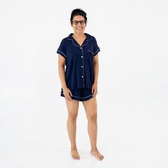 Woman wearing Kyte Baby Women's Short Sleeve Pajama Set in Navy with Cloud Trim Nursing-friendly Relaxed Fit Sleepwear, Relaxed Fit Nursing-friendly Sleepwear, Casual Cotton Nursing-friendly Sleepwear, Nursing Friendly Short Sleeve Sleepwear, Nursing-friendly Short Sleeve Sleepwear, Comfortable Nursing-friendly Sleepwear, Relaxed Fit Matching Sleepwear Set For Sleepovers, Family Matching Loungewear Sets With Short Sleeves, Cozy Cotton Short Sleeve Sleepwear