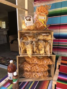 there are many different types of pretzels on the shelf and in bags next to each other