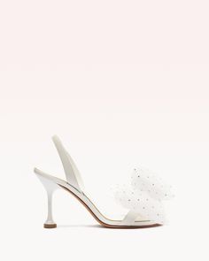 Topped with an oversized tulle rosette, the Isabelle Crystals Bridal heel is a fashion-forward style with statement-making impact. A minimalist slingback strap and our signature flared stiletto heel completes the look of this metallic champagne leather pair. Material: Kid Soft Metal & Tule & Hotfix Leather sole Geometric heel Round toe Heel height: 3.4in | 85mm SKU: B3578200130002 Glamourous Heels, Designer Wedding Shoes, Bridal Heels, Alexandre Birman, Round Toe Heels, White Shoes, Stiletto Heel, Classic White, Wedding Shoes