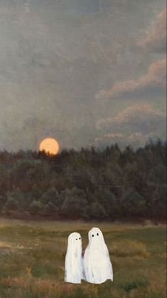 two white ghost figures standing in a field with the sun setting behind them and trees