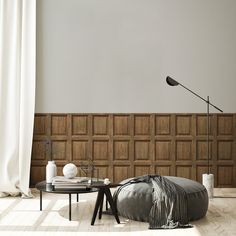 a living room with wooden paneled walls and flooring