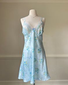 - Secret Treasure's satin pearl blue slip dress featuring rosette prints with lace embroidery bustier lining- bow adorned; adjustable straps; deep v-neckline- size L- stunning condition with no flaws 🤍 Size of mannequin: size 2 - 4 Blue Slip Dress, Blue Outfits, Satin Slip, Blue Outfit, Lace Embroidery, Dress Clothes For Women, Adjustable Straps, Slip Dress, Dress Outfits