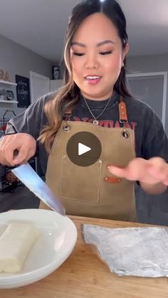 a woman in an apron is making food