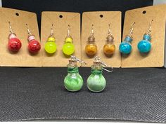 six different colored glass bottles with silver earwires