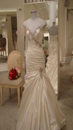 a wedding dress on display in a store