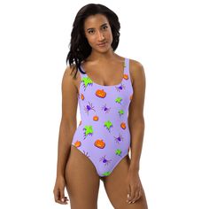 This one-piece swimsuit for all figures will bring out your best features. Enjoy the smooth fabric and the flattering design, and show it off by the sea or pool! • 82% Polyester, 18% Spandex • Fabric weight: 6.78 oz/yd² (230 g/m²), weight may vary by 5% • Chlorine-resistant fabric • Cheeky fit with a scoop neckline and a low scoop back • Zig-zag stitching • Double-layer front • Four-way stretch material stretches and recovers on the cross and lengthwise grainsSize guide CHEST (inches) WAIST (inc Purple Beach Season Bodysuit For Swimming, Purple Bodysuit For Swimming Beach Season, Purple Beachwear One Piece For Swimming, Summer Swimming Bodysuit In Purple, Purple One Piece For The Pool, Fitted Purple Bodysuit For Swimming, Summer Purple Swimming Bodysuit, Playful One-piece Bodysuit For Pool, Purple Bodysuit For Swimming, Beach Season