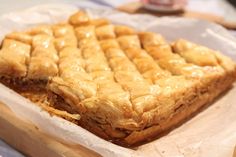 some kind of pastry sitting on top of a piece of wax paper