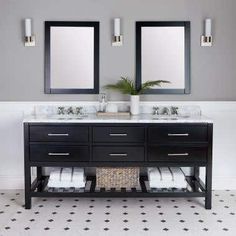 two mirrors are above the double sink vanity in this white and black bathroom with tile flooring