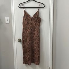 Tank Dress Brown Knee-length Midi Dress For Parties, Brown V-neck Midi Dress For Parties, Brown V-neck Midi Dress For Cocktail, Brown Midi Length Dress For Date Night, Brown Sheath Midi Dress For Party, Brown Sheath Midi Dress For Date Night, Brown Sheath Dress For Night Out, Brown Evening Dress, Midi Length, Brown Knee-length Midi Dress For Night Out