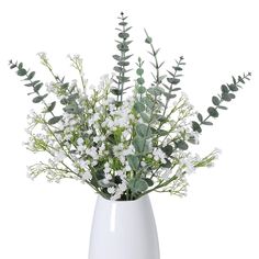 a white vase filled with flowers and greenery