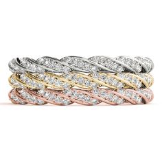 four different colored and white gold rings with diamonds on each band, all stacked together