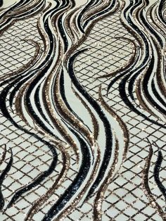 an abstract pattern is shown in black and white, with wavy lines on the ground