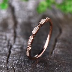 a close up of a ring on a piece of wood