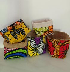 Storage basket, African fabric Reversible fabric planter, ankara african print African wax fabric container Decorative baskets, Ankara fabric Reversible Use it as a storage basket, organizer or a decorative planter Made with double fabric You can choose African print wax fabric on both sides, wax fabric and cotton and linen fabric, or wax and jute fabric. If you don't find the size you want in the list, write to us and we will make it for you. Storage basket, African fabric Burlap planter, baske Fabric Bowls Pattern Storage Baskets, African Baskets For Storage, African Baskets Storage, Make Fabric Baskets, Large Fabric Baskets, Making Fabric Bowls, Whimsical Pottery, Phone Carrier, Basket Organizer