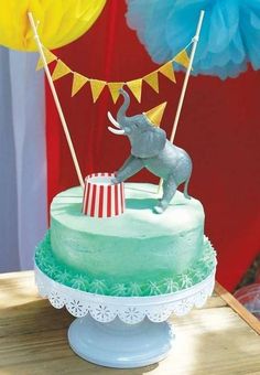 an elephant on top of a circus cake