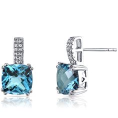 A Swiss affair Inspired by soft, blue skies and charming Swiss blue lakes. These graceful earrings feature cushion cut Peora natural Swiss Blue Topaz gemstones in 14K white gold. Our natural Swiss Blue Topaz gemstones are a unique gift from nature. By cutting them in a way that respects the rough's natural radiance, we ignite their inherent intensity and maximize their brilliance to deliver on our signature Peora standard. Handcrafted in pure 14K white gold goodness, these earrings have been carefully coated in an elegant rhodium finish. Our artisans are expertly trained in this process which fortifies the earring's strength, shine and brilliance. Shopping for birthdays, bridal parties or other occasions? Our concierge stylists are here to help with all of your jewelry questions. Each purc London Blue Topaz Earrings, White Gold Drop Earrings, Jewelry Questions, Blue Topaz Earrings, Sparkle Earrings, Topaz Earrings, Swiss Blue Topaz, London Blue Topaz, Topaz Gemstone