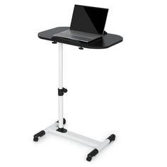 a laptop computer sitting on top of a white and black stand up desk with wheels