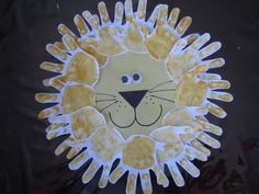 a paper plate that has a lion face on it