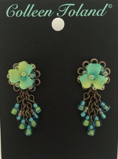 Delicate Flower Earrings in pretty hues of green, turquoise and sea foam green. The flowers are hand painted and beaded with thread and wire. Flower on top with multi beaded drops. . These are stud earrings that are hypoallergenic. This is a lovely little earring that can be worn everyday. Pretty turquoise goes with a lot in your wardrobe and looks good on most complexions. These can be worn with a fancy dress or an every day out fit. Necklace on the model is also available. This is a quality pi Garden Of Eden, Seafoam Green, Delicate Flower, Drop In, Green Turquoise, Sea Foam, Wedding Earrings, Flower Earrings, Fancy Dress