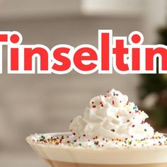 a drink with sprinkles in it and the word tinseltin on top