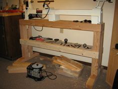 a workbench with tools on it in a room