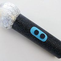 a black and blue toothbrush wrapped in foil