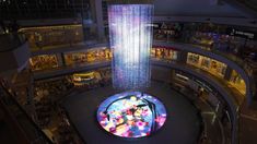 an aerial view of a shopping mall with the words strokes of life projected on it