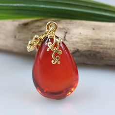 Deep Red amber pendant. Perfect stunning ruby red teardrop shape. Gold plated pendant. High quality. Teardrop shape elegant pendant. All natural parts, not a plastic. Very very small! Very very cute! Tiny gemstone pendant. Weight: 1,4 gr Pendant length 3,2 cm I ship within 1-2 business days. Due to pandemic it can take some time till You get it. Please be patient. If You aren't happy about Your order please contact me first. Solar System Jewelry, Molecule Necklace, Science Jewelry, Planet Necklace, Custom Initial Necklace, Tiger Eye Jewelry, Bottle Jewelry, Amber Pendant, Bee Necklace