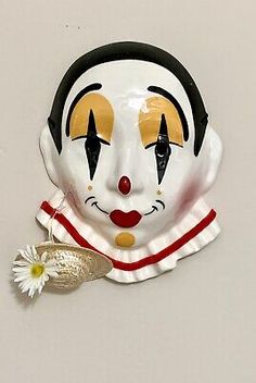 This is a hand painted ceramic mask that has a glossy finish. Masks Ceramic Ideas, Vintage Clown Masks, Porcelain Clown Mask, Clown Pottery, Clown Ceramic, Clown Ceramic Mug, Mask Types, Clown Mask, Ceramic Mask