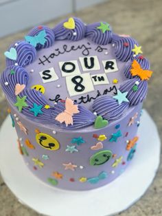 a purple cake with stars and numbers on it