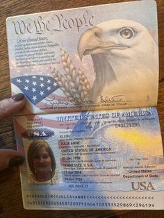 someone is holding up a fake us passport with an eagle on it's front