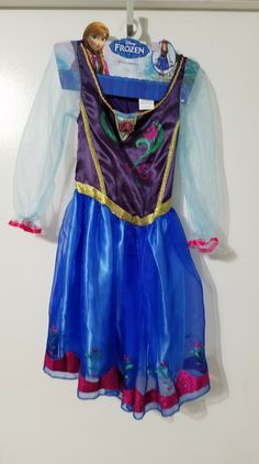 a frozen princess dress hanging on the wall