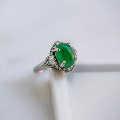 Vintage Mid Century Jade & Diamond Engagement Ring | Amboise Art Deco Green Diamond Ring, Vintage Green Emerald Diamond Ring, Vintage Green Rings With Accent Stones, Green Oval Cabochon Emerald Ring For Wedding, Green Emerald Oval Cabochon Ring For Wedding, Heirloom Green Oval Opal Ring, Vintage Green Diamond Ring With Center Stone, Classic Green Gemstone Diamond Ring, Vintage Green Emerald Ring With Center Stone