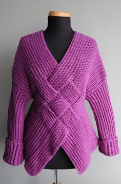 a woman's purple sweater on a mannequin