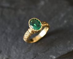 Gold Emerald Ring set with a Created Emerald in a perfect diamond cut, flawless clarity & vivid green Color, at 10x8mm, 3 Carats.Gold Tribal Ring design made of Solid 925 Sterling Silver ☞ made to last. **The ring is plated with 18k Gold (the thickest plating - 3 Micron) over Solid 925 Sterling Silver.Matching Earrings & Pendant - please ask me☞ Choose your size ☞ I resize (before shipping) for FREE to Any size*⌛Last Ring left ⌛Details : ♥ Each item comes in a cute GIFT BOX ✓ ♥ GUARANTEE Green Diamond Cut Ring For May Birthstone, Oval Green Engraved Ring As Gift, Oval Green Engraved Ring For Gift, Anniversary Green Engraved Gemstone Ring, Oval Green Engraved Ring Gift, Green Diamond Cut Rings For Gifts, Green Gemstone Engraved Ring For Anniversary, Green Engraved Promise Ring, Green Gemstone Engraved Ring For Gift